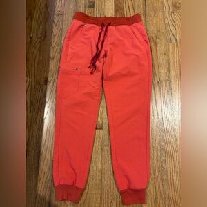 Women Scrub Bottoms, size S. Figs. Would describe the color as coral!
